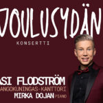 Vaaleatukkainen mies katsoo kameraan. Lisäksi teksti Joulusydän konsertti.